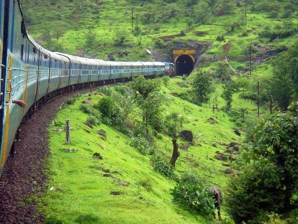 Green Western Ghats landscape viewed from a Mumbai to Goa train
