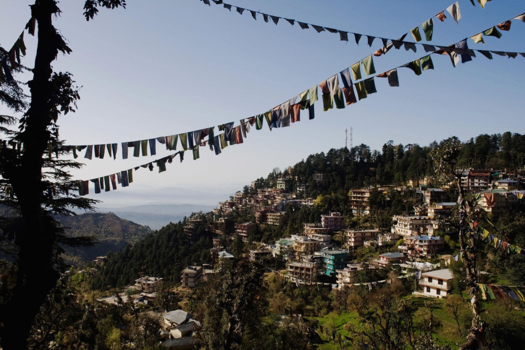 Quiet McLeod Ganj street with Himalayan mountains in the background