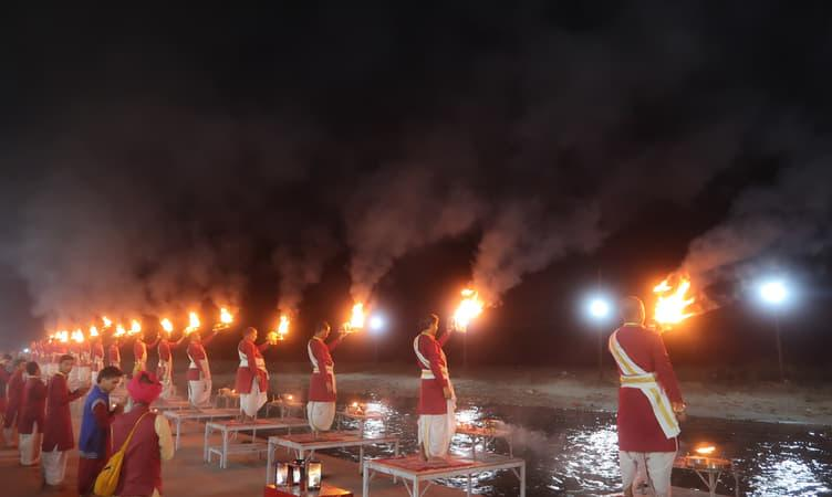 Evening aarti with brass lamps at Ram Ghat on the Shipra River in Ujjain