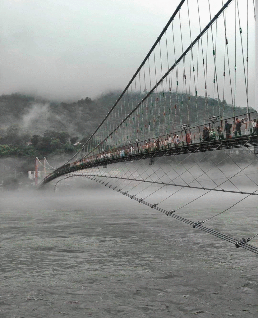Ram Jhula suspension bridge over the Ganga during Rishikesh monsoon