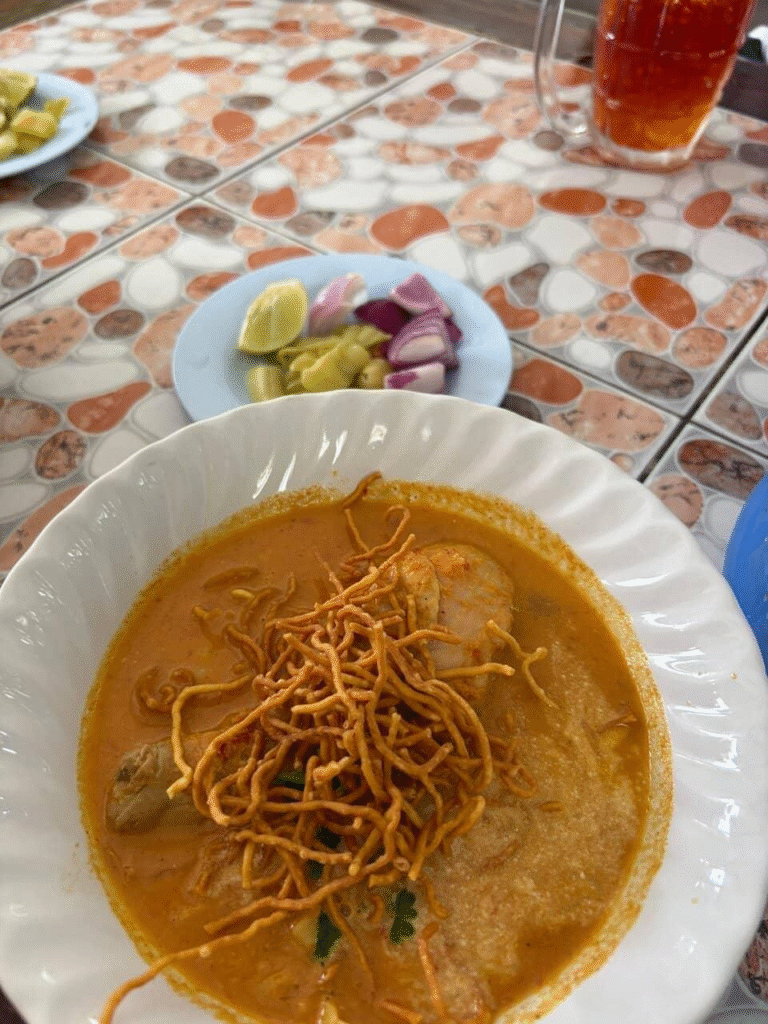 Khao soi northern Thai noodle curry served at a local Chiang Rai restaurant