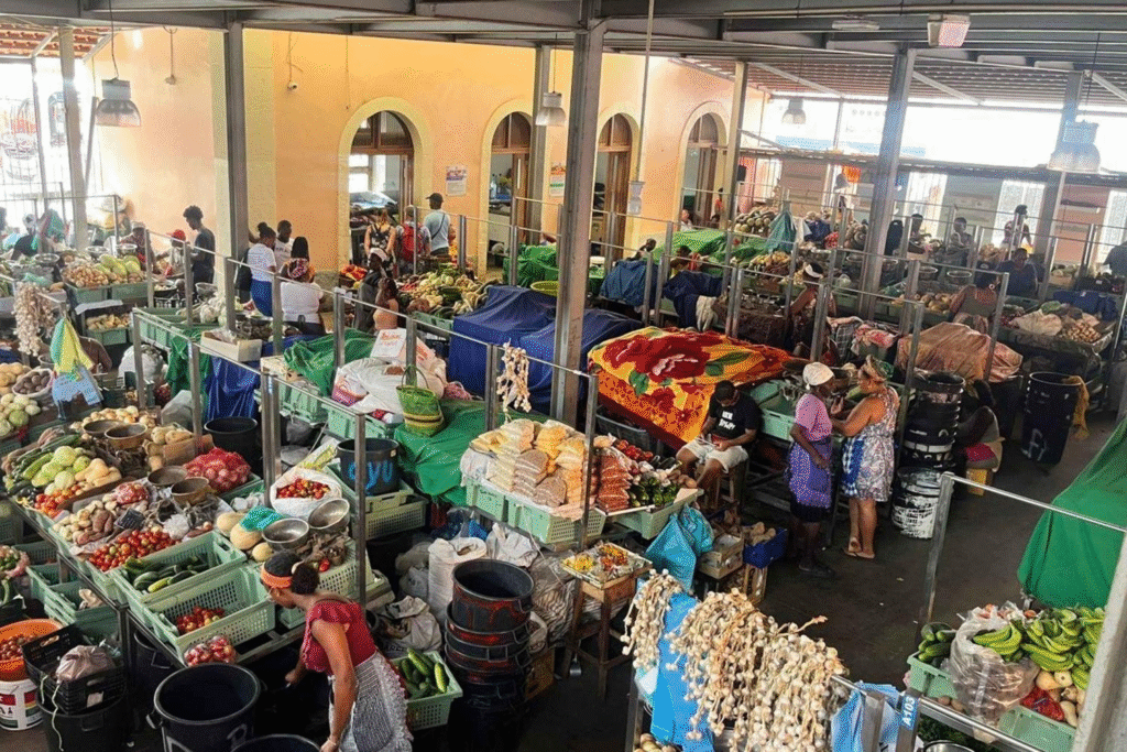 Local market vendors selling fresh produce and dried fish in Praia, Cape Verde